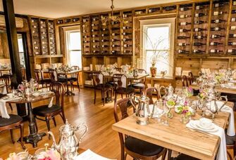 Restaurant dining space with wine bottle wall decor