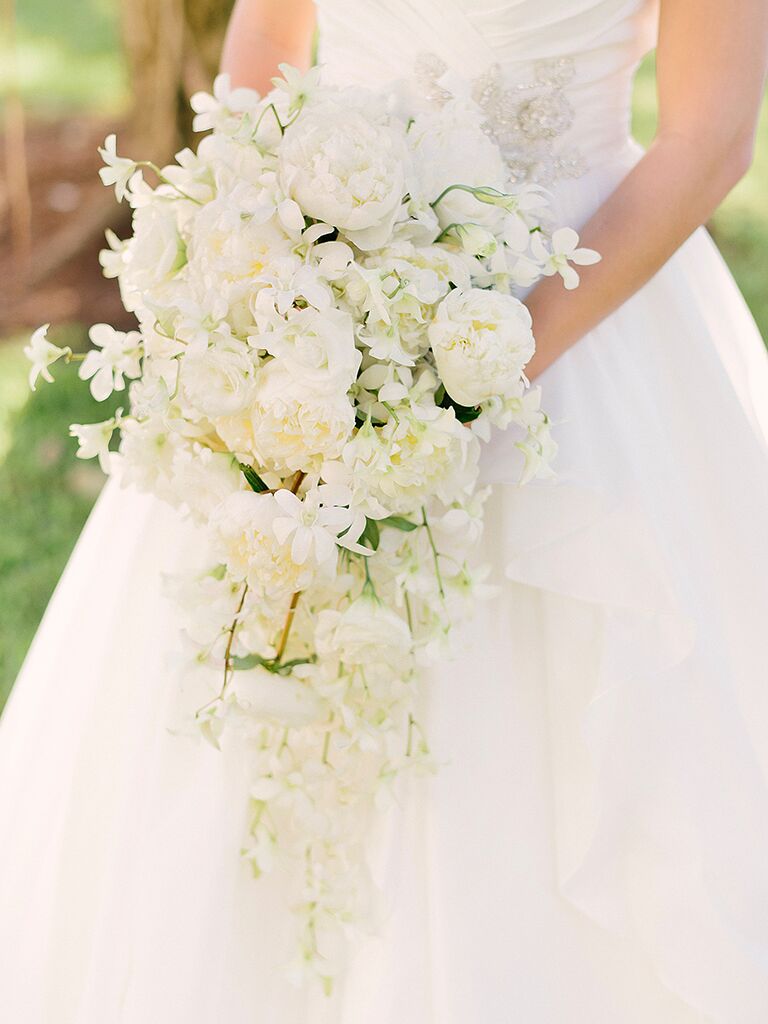 White cascade bouquet with orchids, peonies and lisianthus