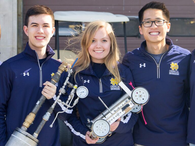 Peter and Hannah met each other through Chem-E car and competed on the same team for two years. The first time they interacted was when Hannah taped down a piece of tape across the workbench for a "No Peter Zone" because Peter was too messy.