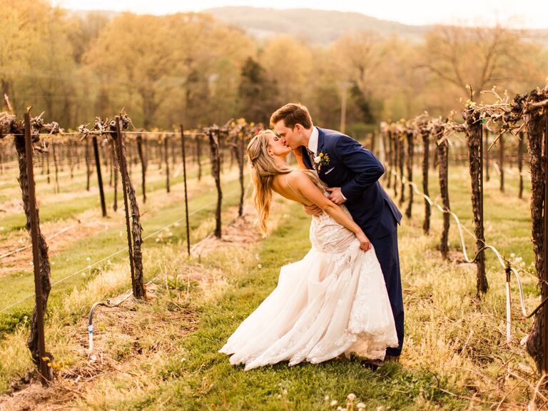 Couple kissing in the vineyard