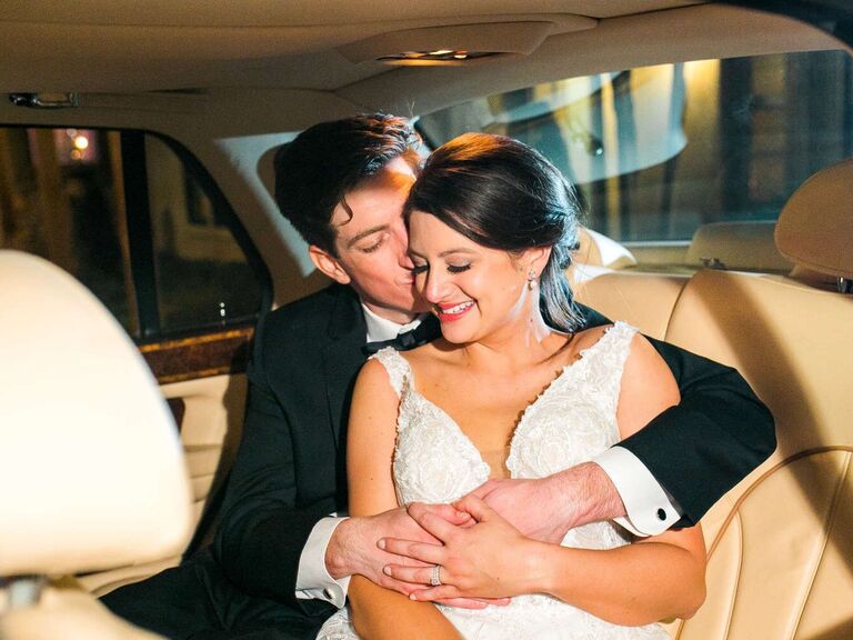 Happy couple in the back of a Rolls Royce