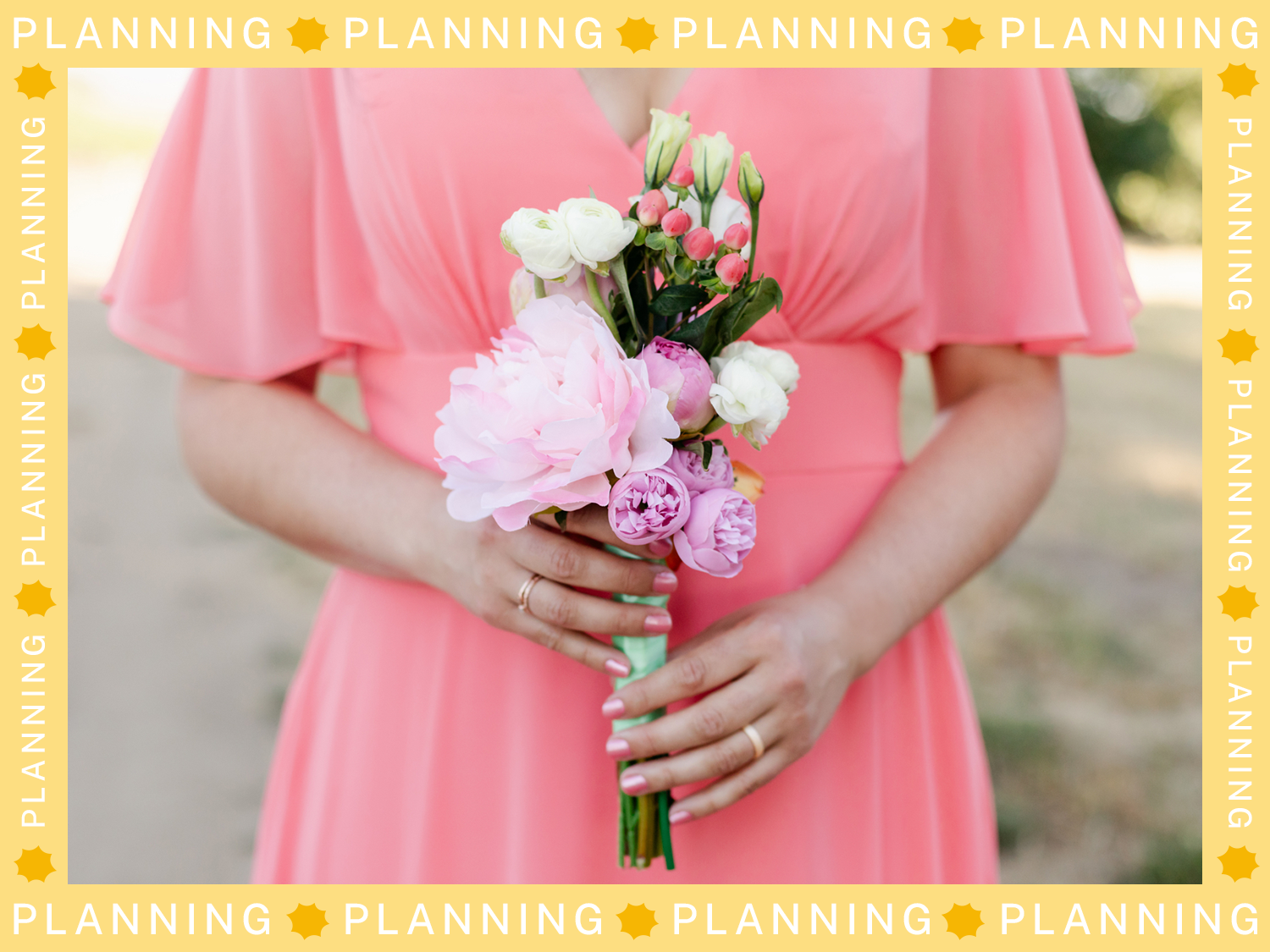 Bridesmaid in coral dress holding bouquet