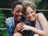 Couple hugging each other and laughing.