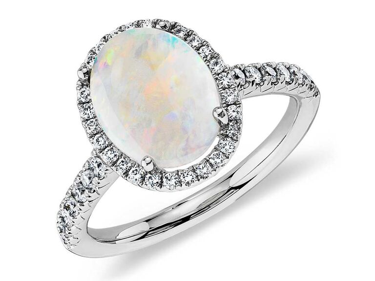 Opal engagement ring with diamond halo