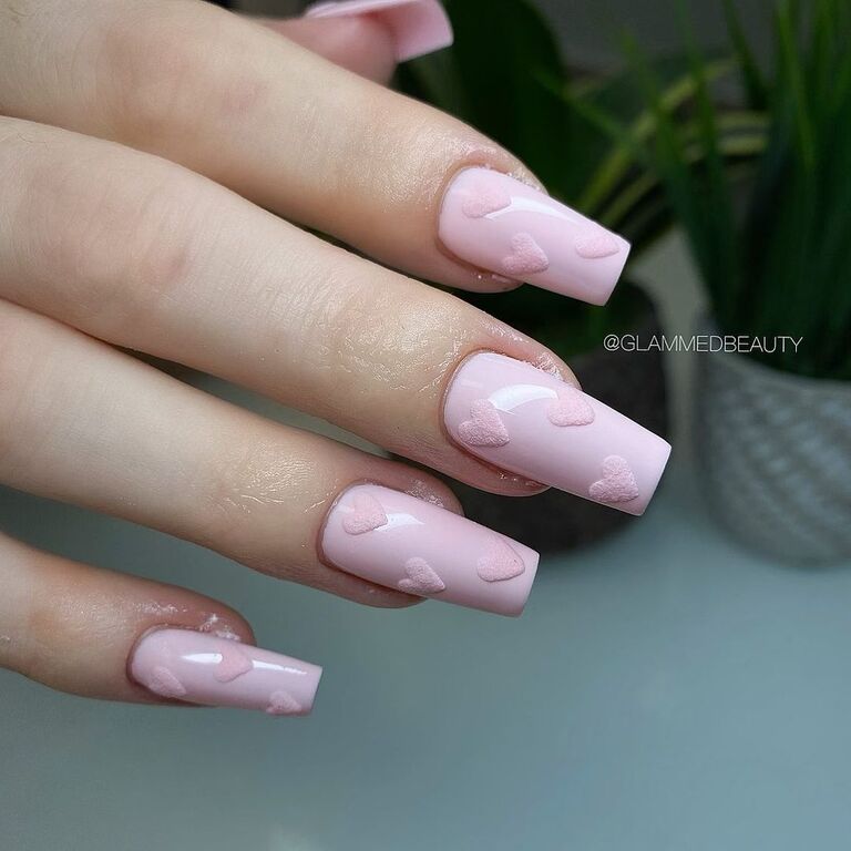 Pink nails with heart design balletcore wedding nail trend