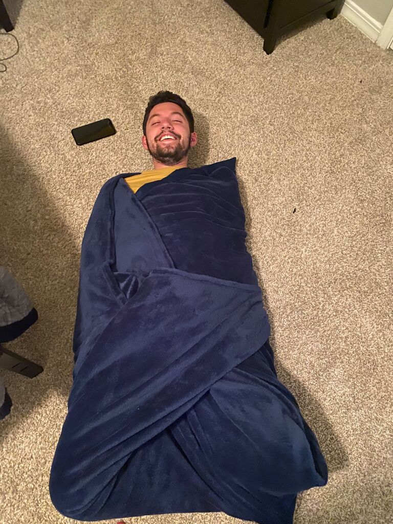 Learning how to swaddle in nursing school. Caleb was a great sport.