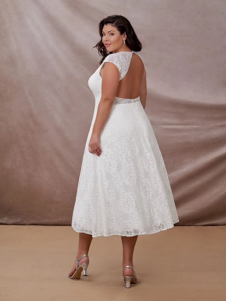 Best mid length plus size wedding dress by Azazie. 