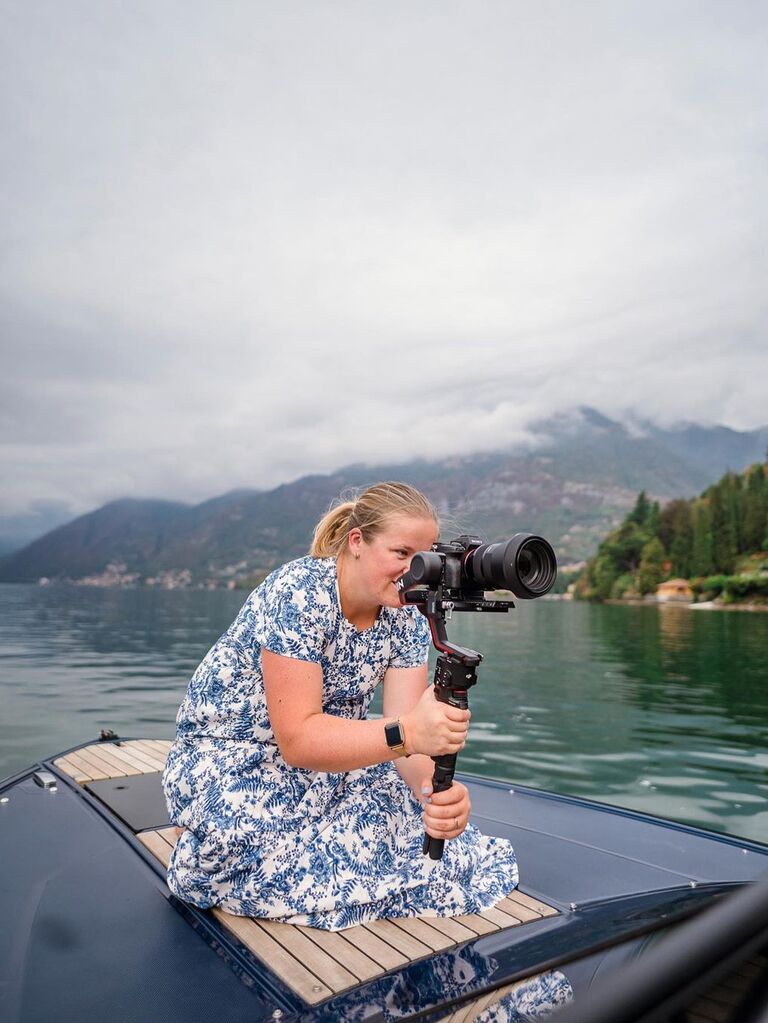Wedding videographer shooting video content on a boat