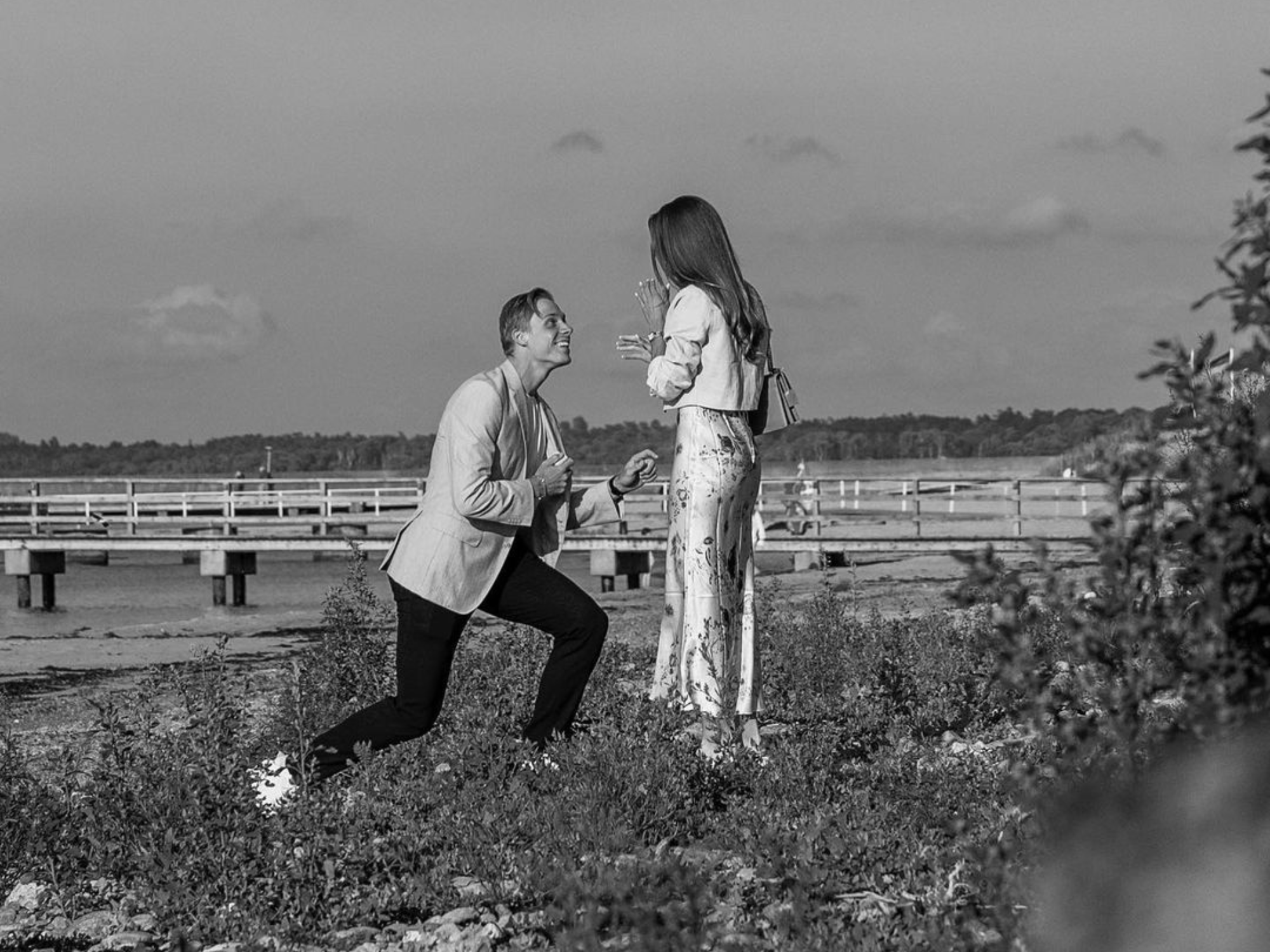 Denis Shapovalov proposing to Mirjam Björklund in a field on black and white instagram post