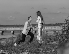 Denis Shapovalov proposing to Mirjam Björklund in a field on black and white instagram post