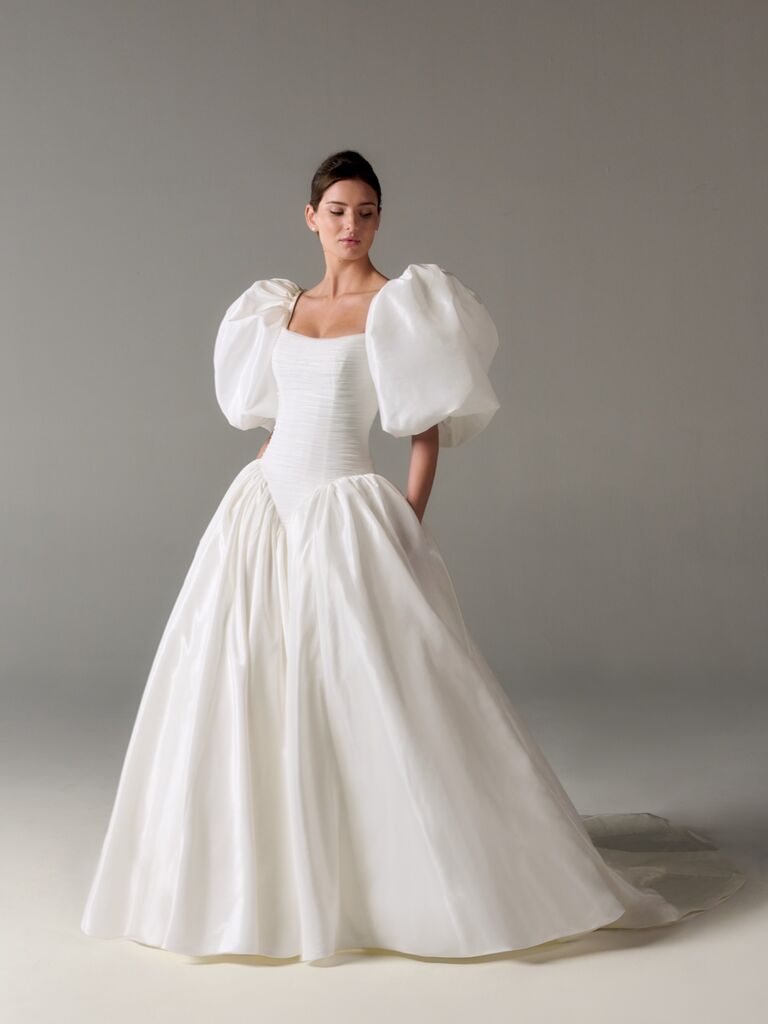 Dramatic Poeza weddin dress with basque waistline and oversized puff sleeves