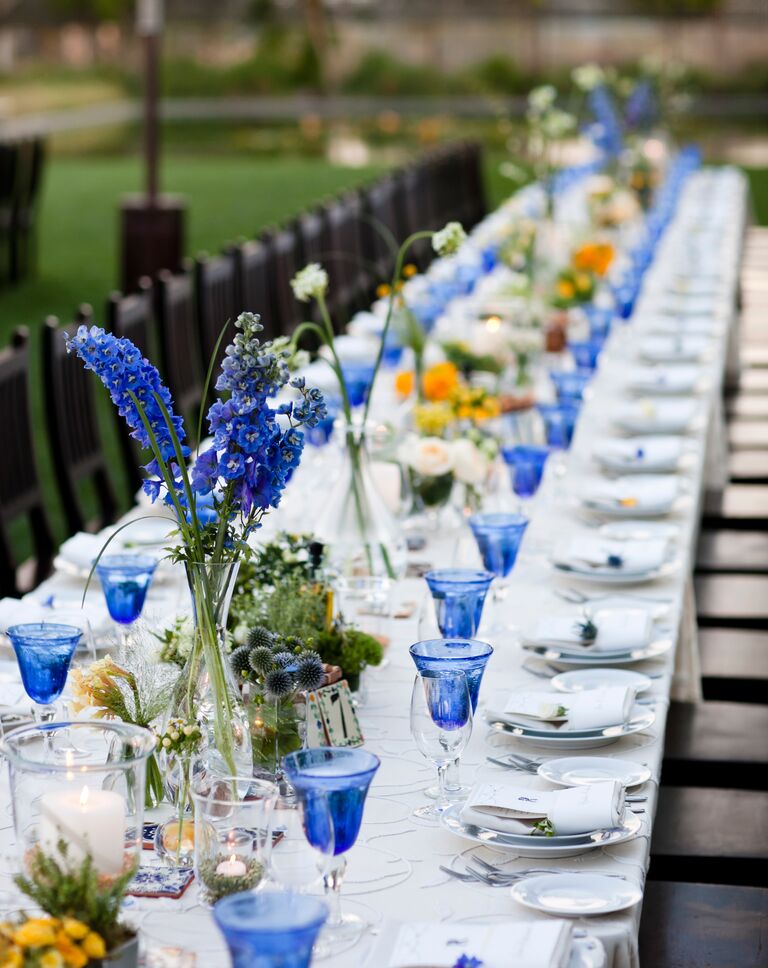 Blue colored glassware at an outdoor wedding reception
