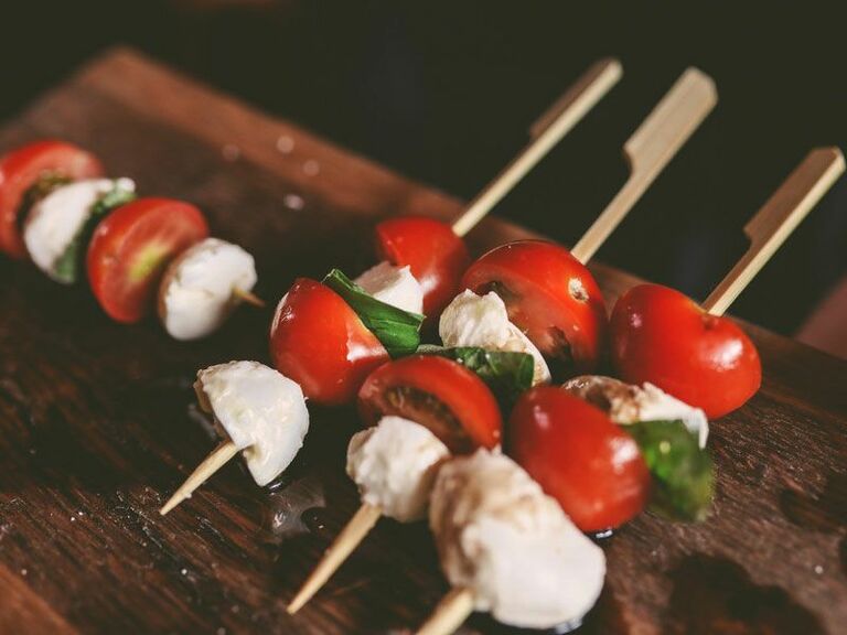 Tomato, mozzarella, and basil skewers served at a bridal shower.