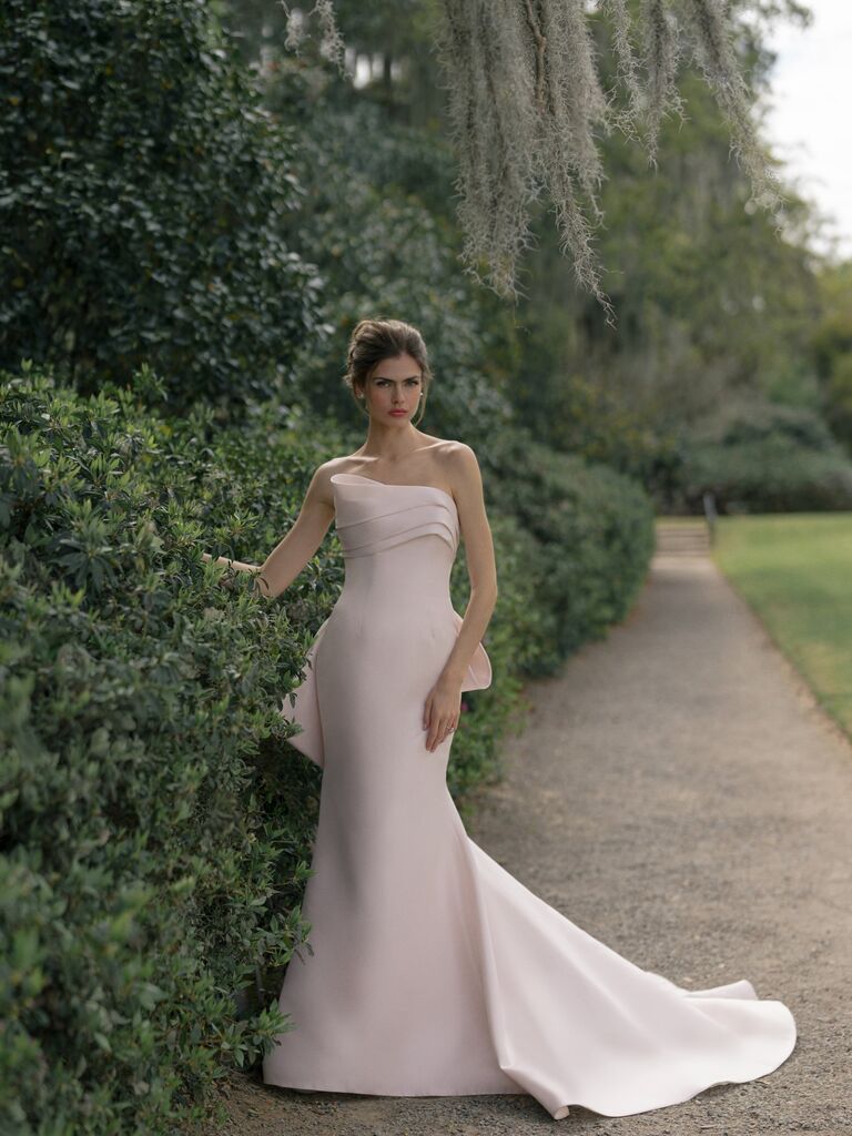 Anne Barge asymmetrical strapless neckline blush pink wedding dress