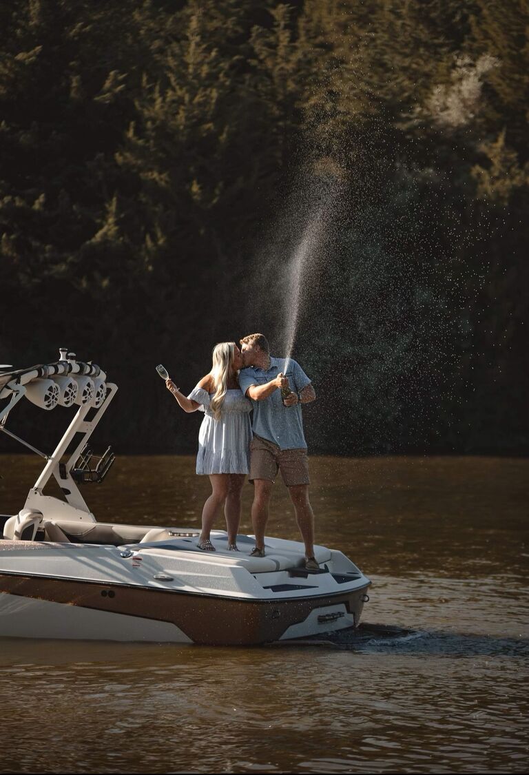 The engagement! Adam pulled off the best surprise. Ainsley was told that they were going to be taking family photos at her grandparents' cabin at Jeffery Lake. Everyone got dressed up in family photo attire and Ainsley, Adam, Thea, and Julie took a boat ride where Adam popped the question!