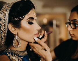 Indian bride getting her makeup done