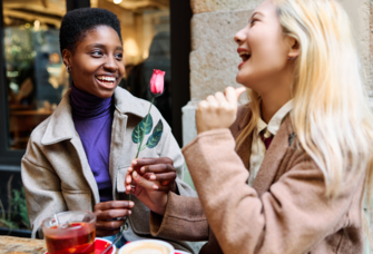 Woman giving partner rose on valentine's day