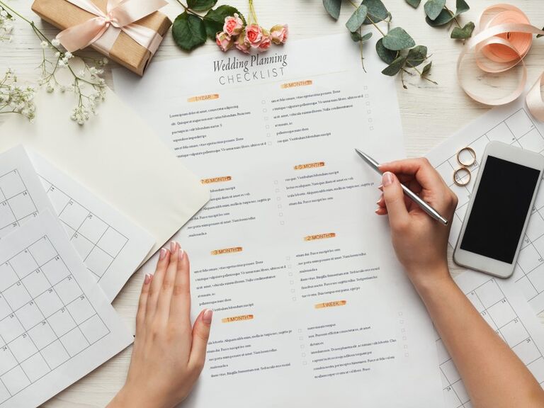 Bride working on her wedding check list