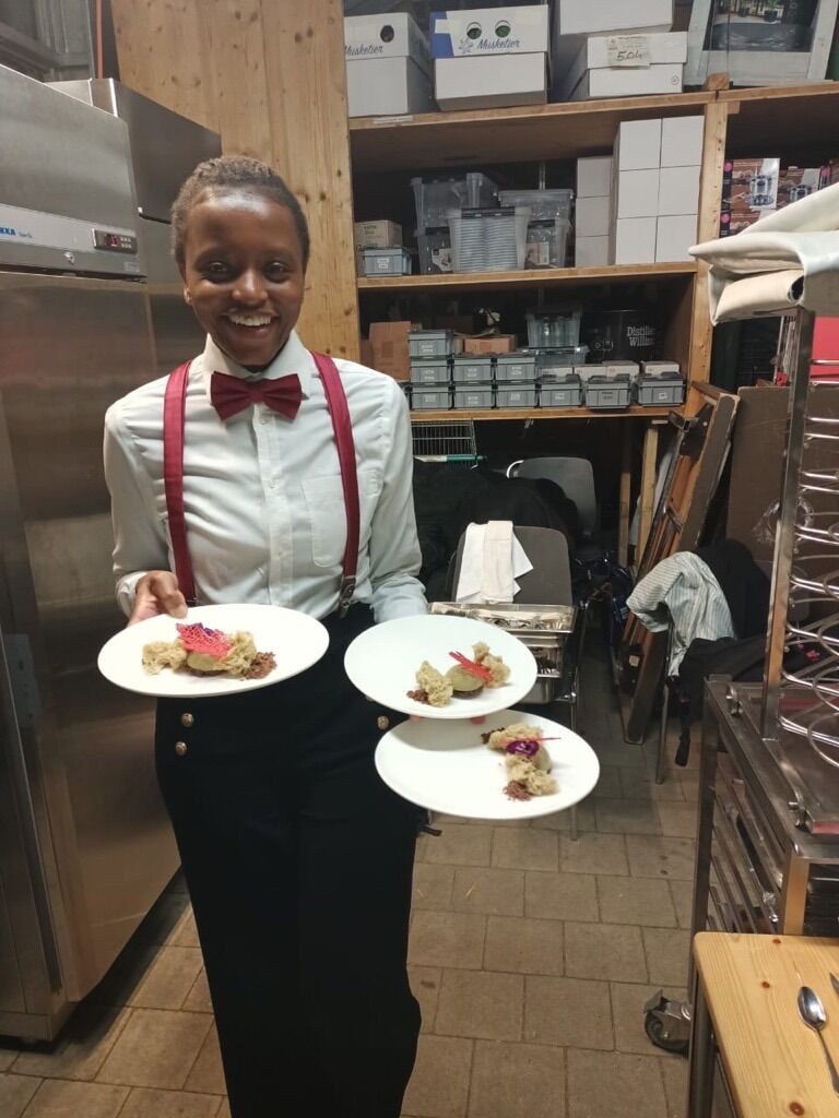 June looks dapper in her dinner service outfit