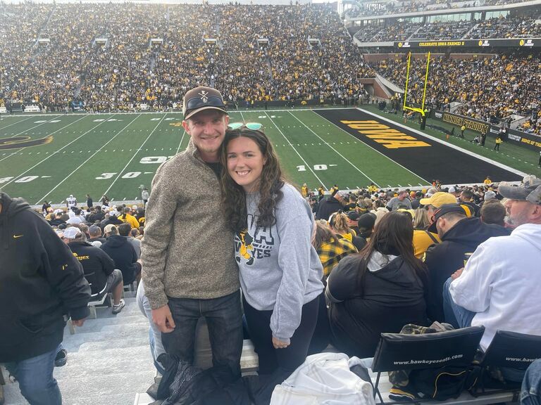Sharing one of Abbie's absolute favorite pastimes: cheering on the Hawkeyes at an Iowa game!