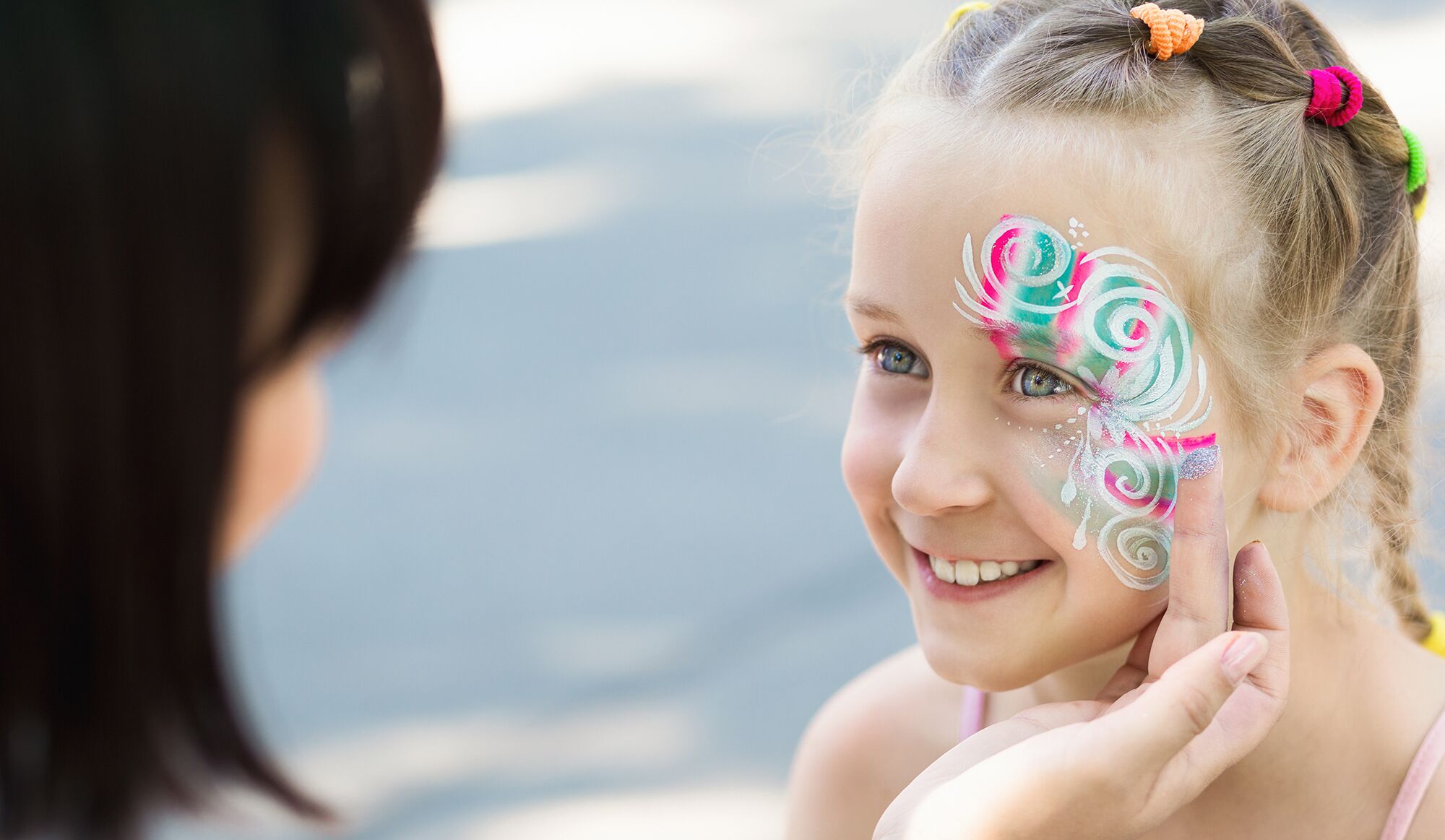 young girl with face painter