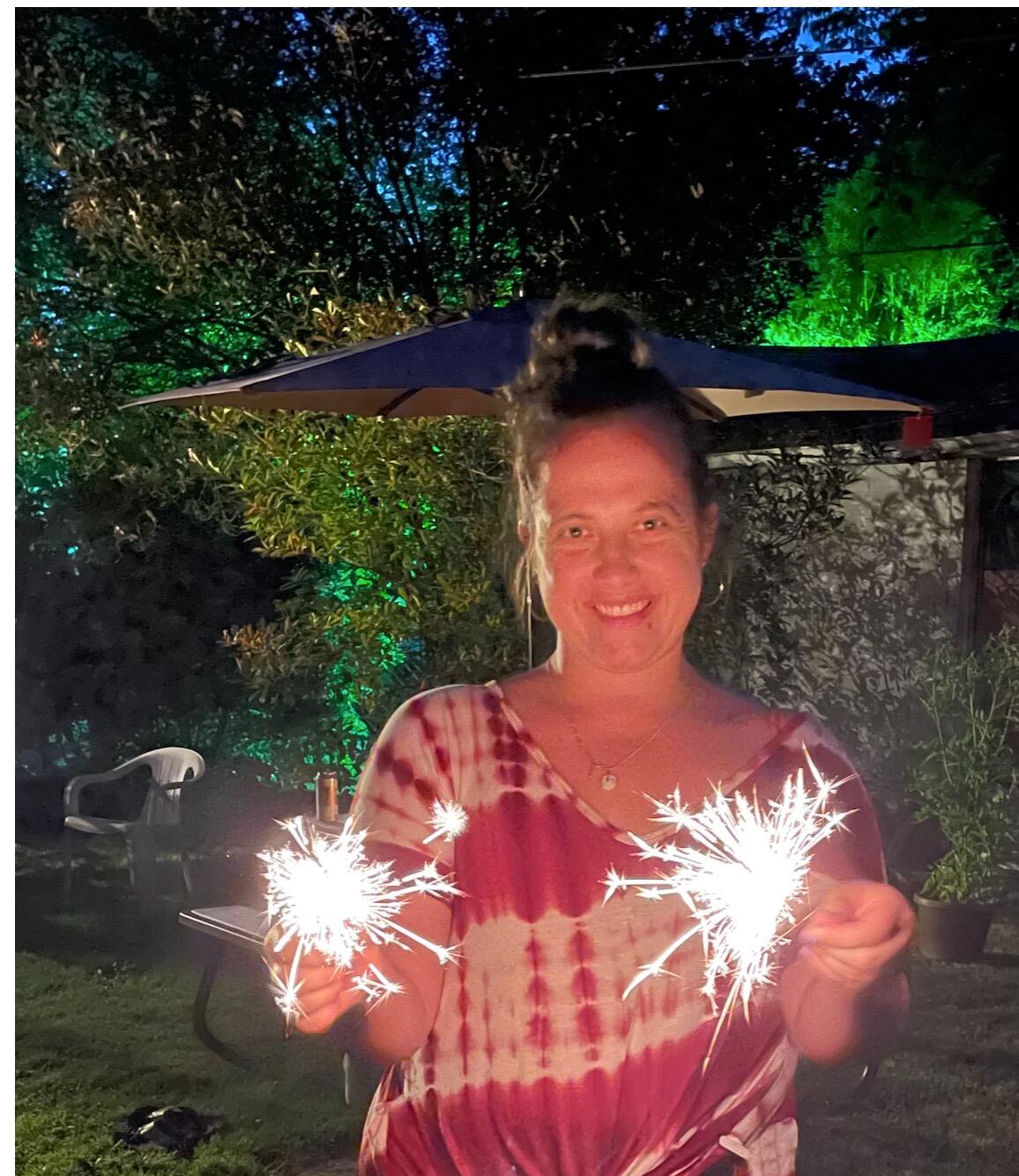 Ilze lights sparklers for the first time with Russell and his mom in Tacoma!