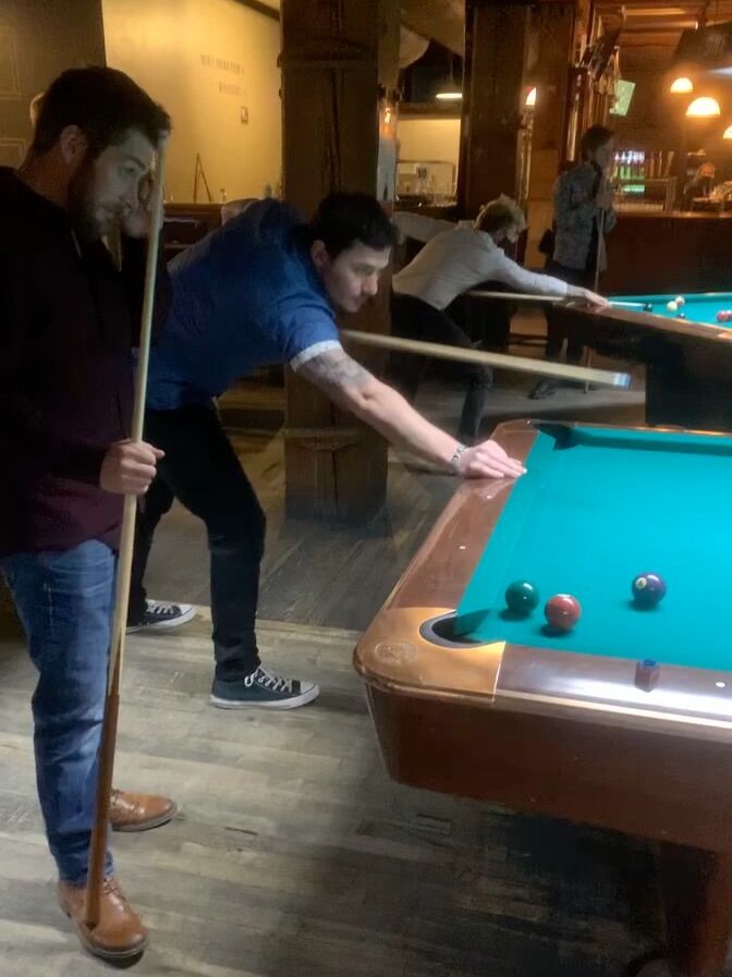 Josh and Justin (A Groomsman), playing pool in Denver Colorado.