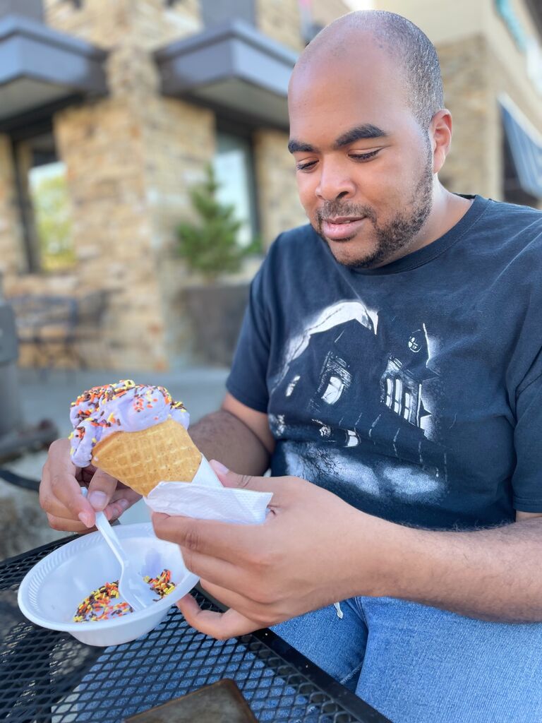 A trip to Silas and Maddie's Ice cream. Patrick eating Purple Unicorn Fluff ice cream with sprinkles. 