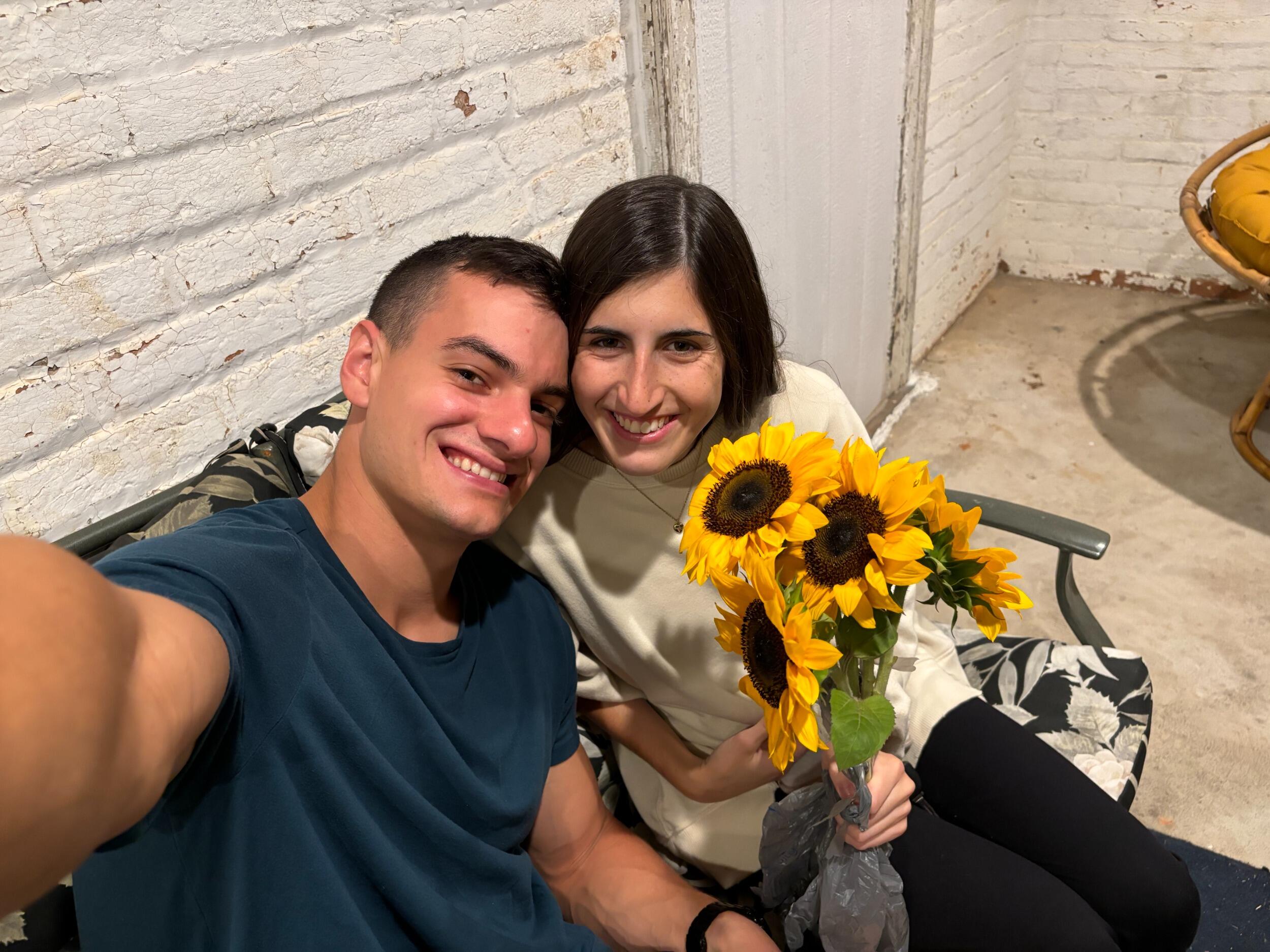 Nate dropped by to give Jackie a bouquet of sunflowers as a housewarming gift for her new apartment 