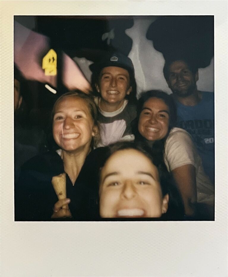 We met over a game of dutch blitz with our best friends at HoneyRock Camp in the Northwoods of Wisconsin! Sophie was just up for a weekend visiting:) Our own rom-com "meet cute".