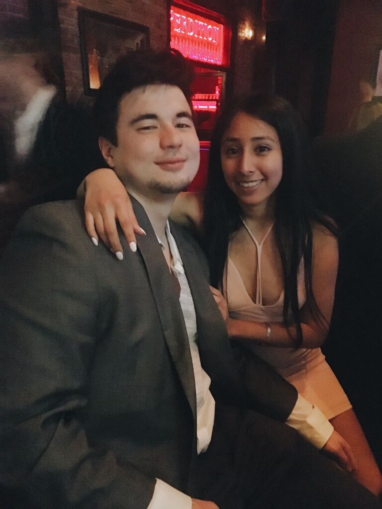 After a few months of getting to know each other, we went to our first date party together. (This is also our first photo together).