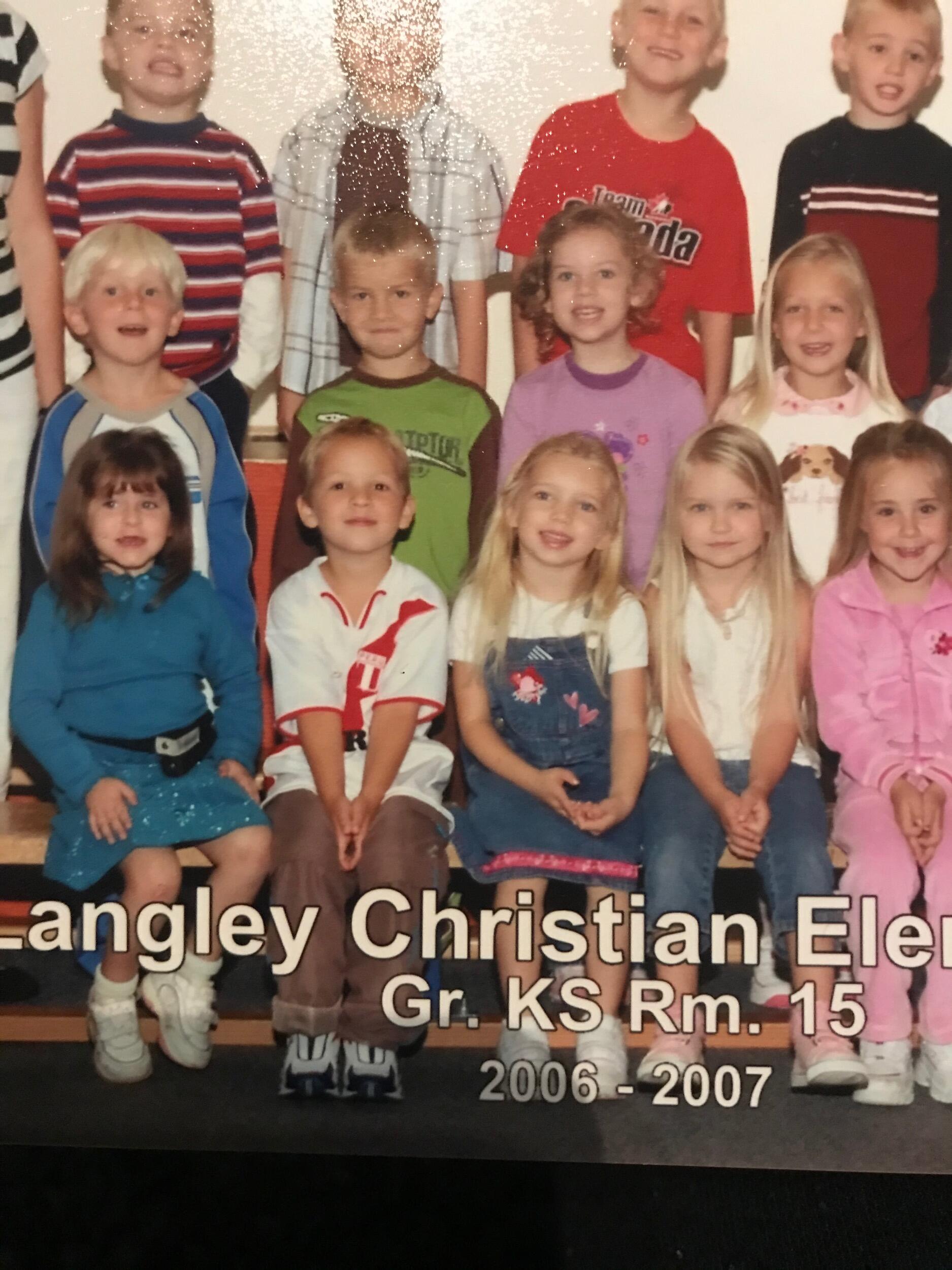 Sitting beside each other in our Kindergarten class photos