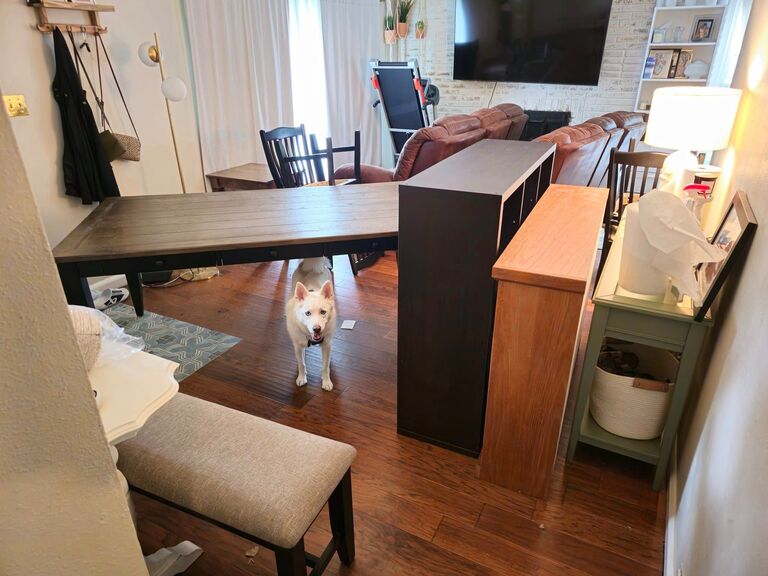 Kota smiles among all the furniture as his mom and dad join their households.