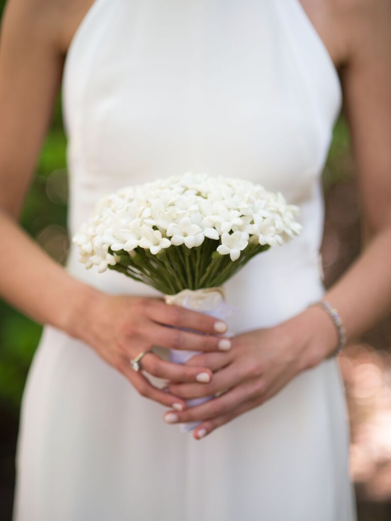 This small white stephanotis wedding bouquet is sure to stun.