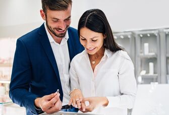 Couple looking at engagement rings