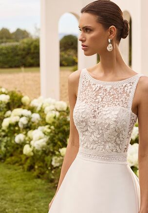 Wedding dress with boat neckline and straps, square back. Beaded lace bodice, A-line silhouette with plain mikado skirt.