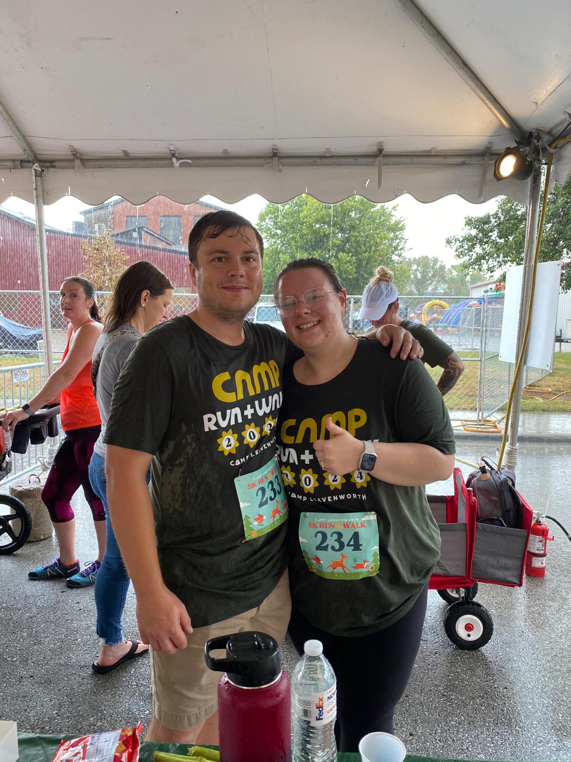 Our first 5K -  Sue was 15 weeks pregnant, and it rained the entire time, so we will never know if we were drenched from the rain or our sweat!
