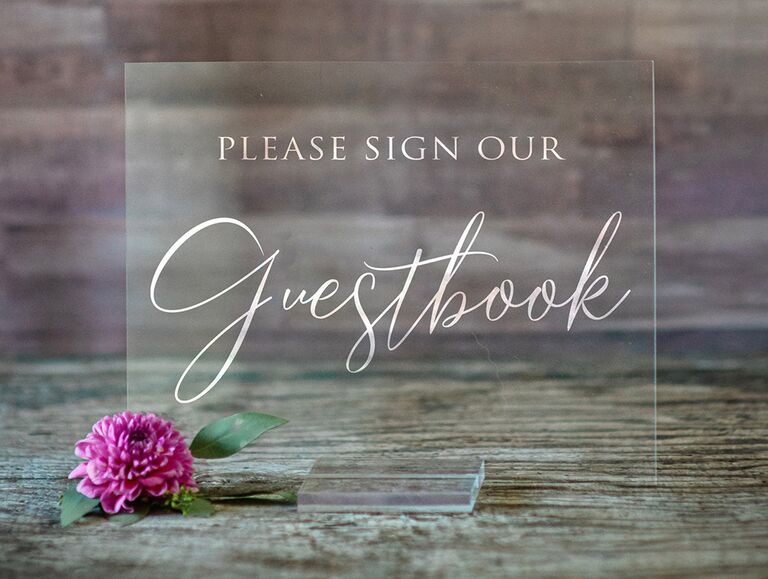 Rectangle acrylic sign saying 'Please sign our guestbook' in elegant white type 