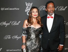 Tina Knowles and Richard Lawson pose at an event