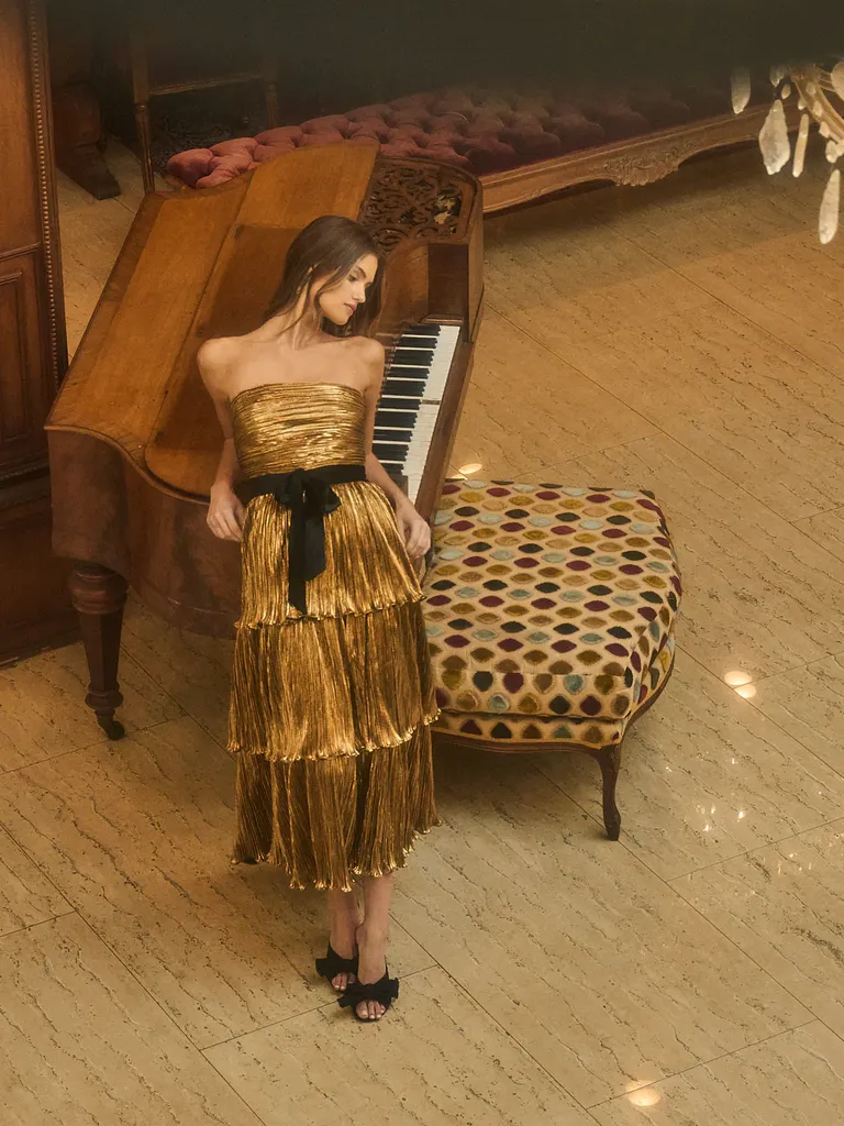 Metallic gold strapless wedding guest dress from Sugarlips