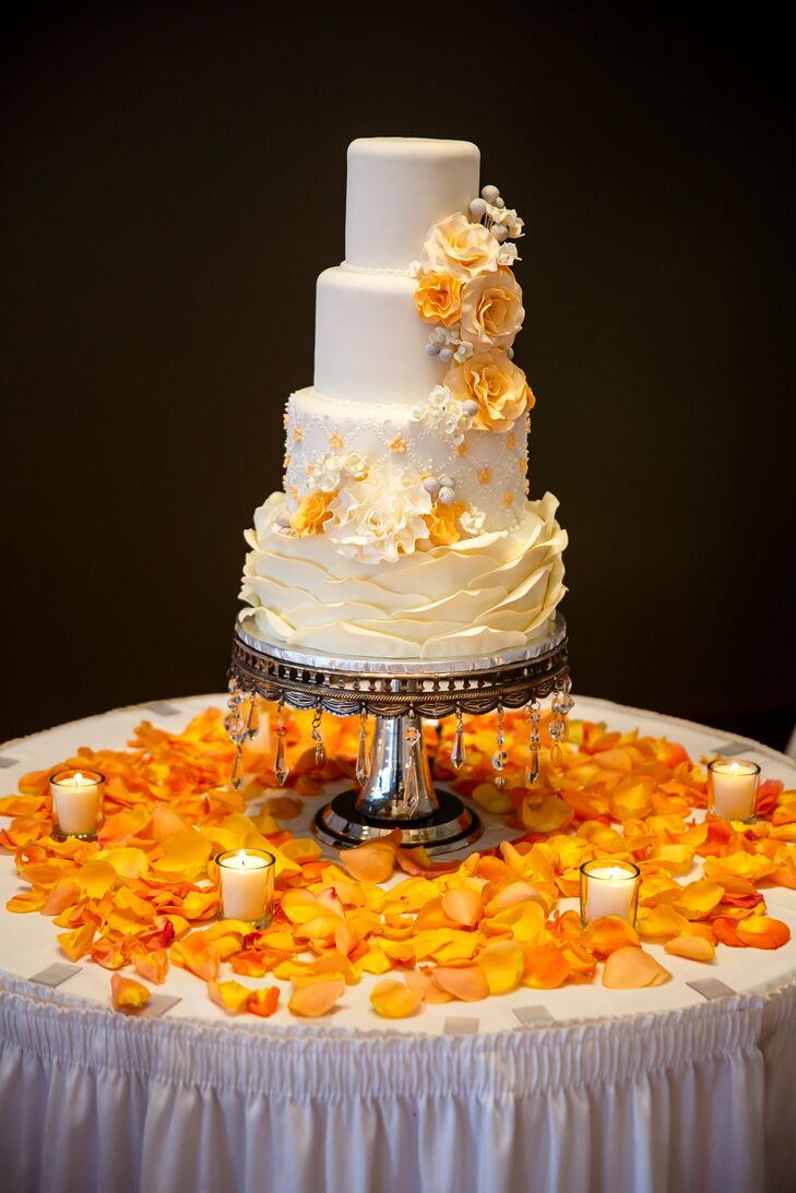Four Tier Wedding Cake With Orange Flowers