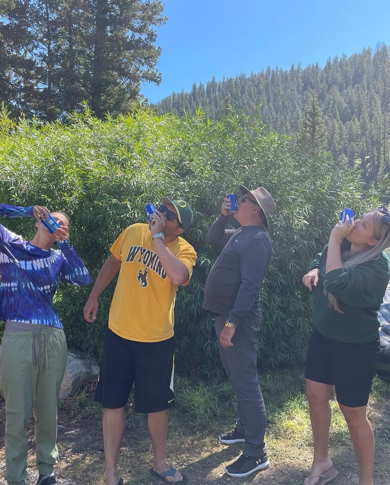 Camping at the Hoback with Ryan's family and friends. Celebrating a great day rafting the river and Adar really taking advantage of her "fun employment"