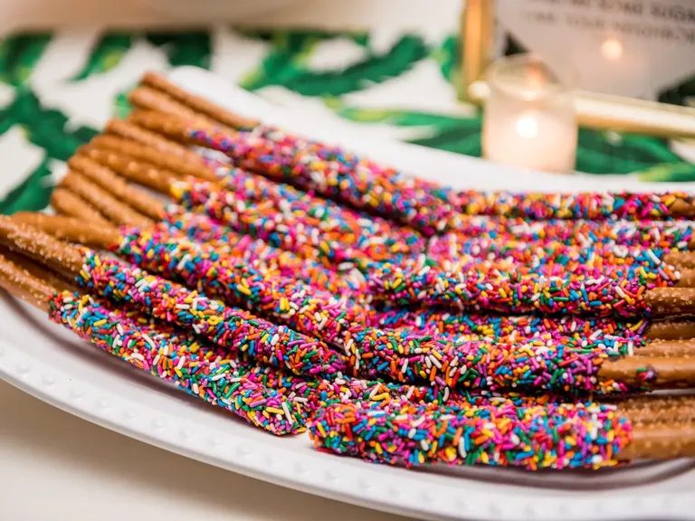 Chocolate covered pretzel sticks engagement party dessert
