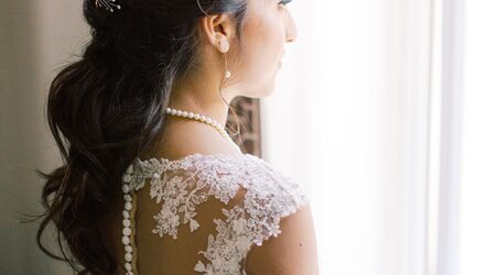 Premium Photo  Close-up of the bride's hairstyle. curls. jewelry with pearls  for hair. wedding ceremony. preparatio