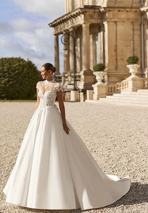 A-line wedding dress with illusion neckline and back, short sleeves. Lace bodice with beading, plain mikado skirt.