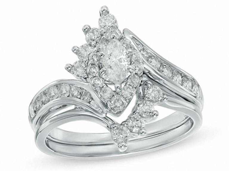 Marquise diamond center with white gold ribbon borders and double diamond framed band