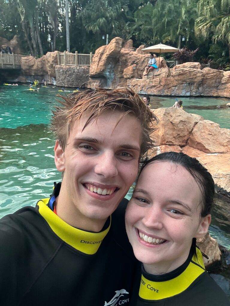 They embarked on many adventures together, her favorite being when they swam with dolphins and snorkeled with sharks.