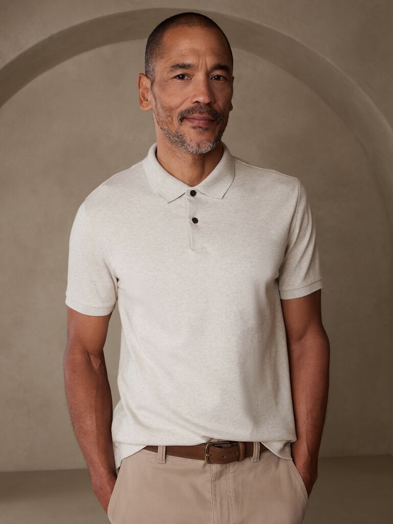 Model wearing a luxurious soft cotton polo shirt in oatmeal