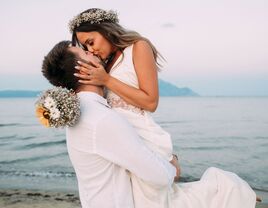 Bride and groom kissing at destination wedding
