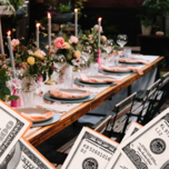 A couple lean in together, smiling, at this outdoor rehearsal dinner.